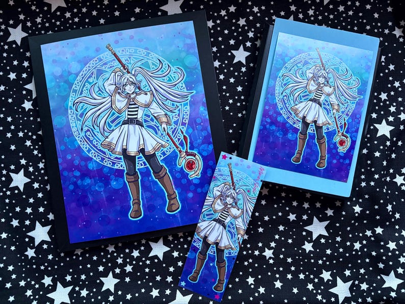 May include: A collection of fantasy art prints and a bookmark. Each item features a female character with long white hair, a white dress, and a staff. The background is a blue and purple gradient with a circular design. The items are on a star-patterned surface.