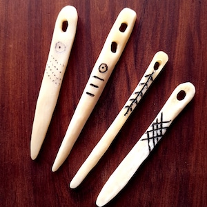 Needle binding needles, bone needles