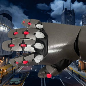 May include: A metallic gray robotic hand with red and white accents. The fingers and palm are articulated, with red circular details at the joints. The background features a cityscape with buildings and a street.