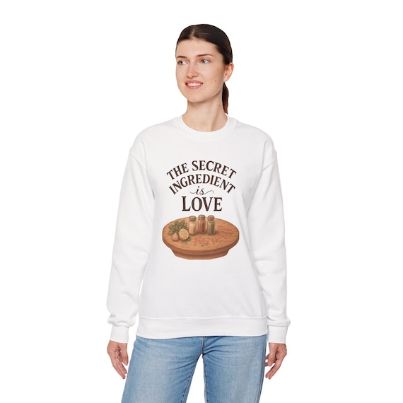 The Secret Ingredient Is Love Sweatshirt | Baking Heart Illustration