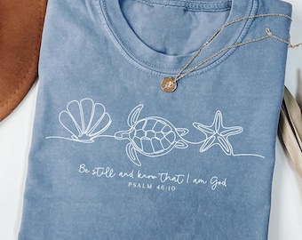 Be Still and Know T-Shirt, Sea Turtle Starfish Shell Design