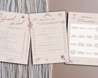 May include: Three beige paper sheets with pink text and illustrations. The sheets have text that reads "He said, she said", "Would she rather?", and "Bridal Shower". The sheets are for a bridal shower game.