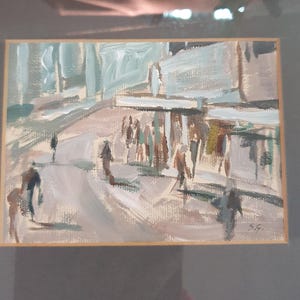 May include: An impressionistic painting of a street scene with figures. The artwork features muted tones of gray, brown, and blue, with visible brushstrokes. The painting is framed in a light wood frame, suggesting a focus on urban life and art.
