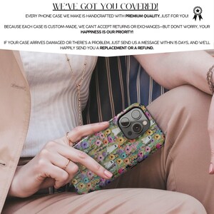 May include: A phone case with a floral and ghost pattern is held by a person. The case has a colorful design with flowers and small white ghost figures. The text on the image says, "WE'VE GOT YOU COVERED!" and "HAPPINESS IS OUR PRIORITY!"