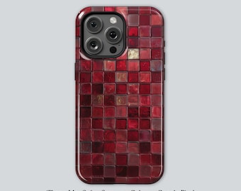 May include: A phone case with a mosaic tile design in shades of red. The case has a glossy finish and a square pattern. The camera lenses are visible at the top. The text at the bottom says "iPhone MagSafe • Samsung Galaxy • Google Pixel".