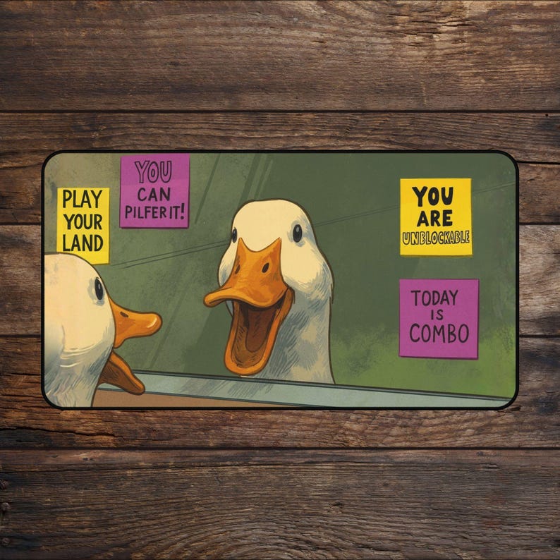 K&ouml;nnte beinhalten: Rechteckiger Cartoon-Druck mit einer wei&szlig;en Ente mit orangefarbenem Schnabel und gr&uuml;nem Hintergrund. Der Text enth&auml;lt "PLAY YOUR LAND", "YOU CAN PILFER IT!", "YOU ARE UNBLOCKABLE" und "TODAY IS COMBO".