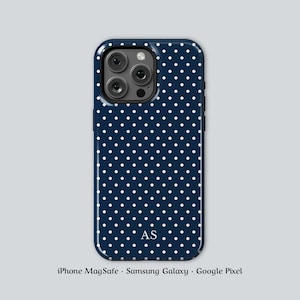 May include: Navy blue phone case with a white polka dot pattern. The case has a glossy finish and features the initials "AS" in the lower center. The case is designed for iPhone MagSafe, Samsung Galaxy, and Google Pixel phones.