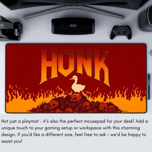 May include: A rectangular playmat with a red and orange background featuring the word "HONK" in large orange letters. A white duck stands above a pile of skulls. The playmat is designed for gaming.