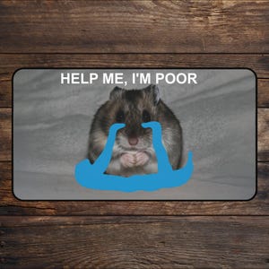 May include: A rectangular mousepad featuring a hamster with a sad expression and blue tears. The text "HELP ME, I'M POOR" is displayed above the hamster. The background is a light gray color.
