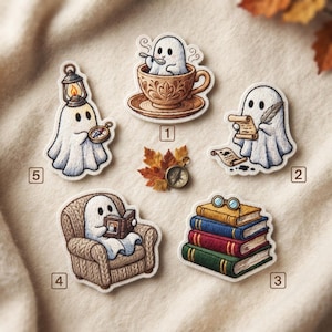 May include: A set of five stickers featuring white ghosts: one in a brown teacup, one writing with a quill, one reading a book in a chair, one holding a lantern and compass, and one with a stack of books and glasses, plus a small compass and autumn leaves.