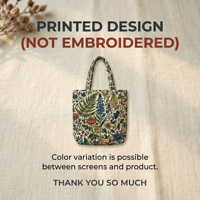 May include: A small tote bag with a floral print featuring ferns, roses, and other botanical elements. The bag has a cream-colored background and a matching handle. Text on the image reads "PRINTED DESIGN (NOT EMBROIDERED)" and "THANK YOU SO MUCH."