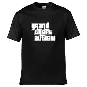May include: Black t-shirt featuring the text "grand theft autism" in a white, bold font with a black outline. The design is a parody of a popular video game logo. The t-shirt has a crew neck and short sleeves.