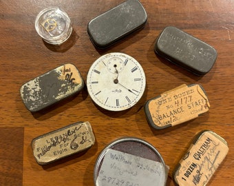 A Collection of Vintage Watch Repair Parts in Tiny Tins and A Watch Face with Parts Metal Pieces for Steampunk Jewelry Crafting