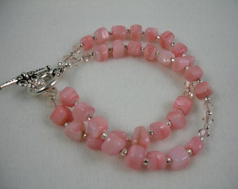 Bracelet with coral colored MOP cubes and Swarovski crystals, toggle clasp, light coral color, double stranded