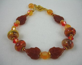 Bracelet with lamp work glass beads, leaves and crystals, orange bracelet, autumn bracelet, fall jewelry