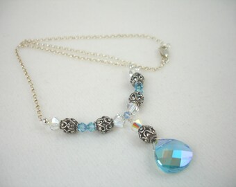 Necklace with pear shaped crystal pendant, custom coated Swarovski crystals, crystal and sterling silver