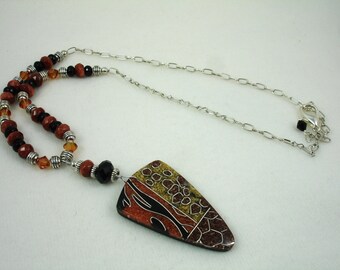 Beaded necklace with triangular shaped pendant, brown and black necklace, goldstone and crystals with abstract design pendant