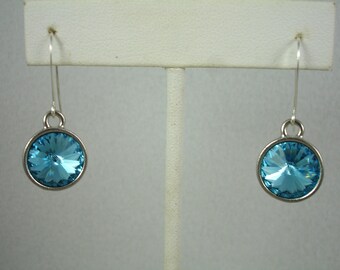 Crystal earrings, bezel set aquamarine Swarovski crystals on sterling silver ear wires, circular shape