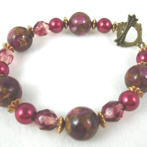 Bracelet with composite stone, Czech crystals and vintage pearls, toggle closure, shades of maroon, magenta