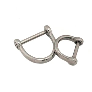 May include: Two silver D-ring shackles. One is larger than the other. Each has a curved body and a removable pin. The shackles are made of a shiny, metallic material, suitable for various applications.