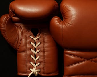 Vintage brown leather boxing gloves.
