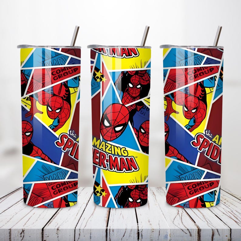 May include: Three stainless steel tumblers with Spider-Man comic book graphics. The design features Spider-Man in action poses, with text that reads "The Amazing Spider-Man" and "Comic Group". The tumblers have a straw and are set against a white wooden surface.