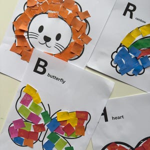 May include: A collection of educational art projects featuring colorful paper mosaics. The images include a lion, a butterfly, a rainbow, and a heart, each with a letter of the alphabet. The artwork is on white paper.