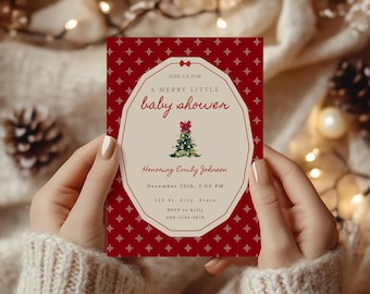 May include: A rectangular baby shower invitation card with a deep red background featuring a white star pattern. The center has a cream-colored octagonal frame with a small red bow at the top, a watercolor Christmas tree, and text.