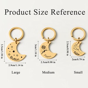 May include: Gold-colored crescent moon keychains in three sizes: large (2.9cm/1.14 in wide), medium (2.5cm/0.98 in wide), and small (2cm/0.79 in wide). Each keychain has a different design and name: Button, Pepper, and Nala.