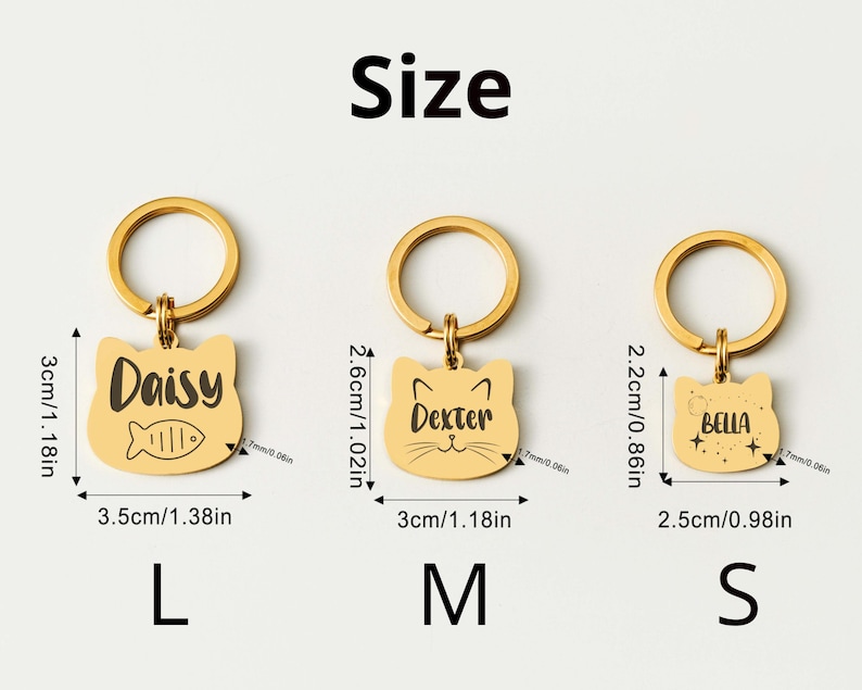 May include: Gold-colored cat-shaped pet ID tags in three sizes: L (3.5cm/1.38in wide), M (3cm/1.18in wide), and S (2.5cm/0.98in wide). Each tag has a ring for attachment and features a pet's name: Daisy, Dexter, or Bella. The tags also include a fish or star design.
