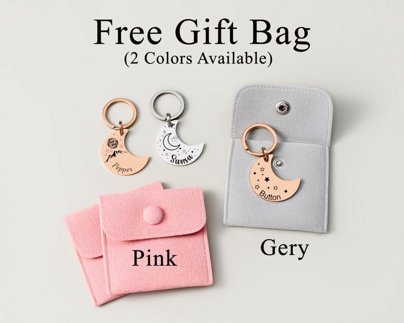 May include: A collection of crescent moon keychains in rose gold and silver, with personalized text and designs. The keychains are displayed with pink and gray gift bags. Text on the image reads "Free Gift Bag (2 Colors Available)".