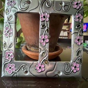 May include: A rustic wooden sign with the text "Welcome to our home" in white lettering. The sign features a distressed finish and a simple, inviting design, perfect for entryway decor.