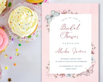 May include: A pink bridal shower invitation with floral and butterfly accents. The invitation includes the text "Join us for a Bridal Shower Honoring Alisha James" and event details. Cupcakes with colorful frosting and sprinkles are in the background.