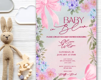 May include: A baby shower invitation featuring the text "Baby in Bloom" with floral and bow decorations. The invitation includes event details and RSVP information. The design incorporates pink and purple hues.