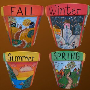 May include: Four painted terracotta flower pots depicting the seasons: Fall, Winter, Summer, and Spring. Each pot features a different landscape scene with houses, trees, and seasonal elements. The word "SEASONS" is written at the bottom.