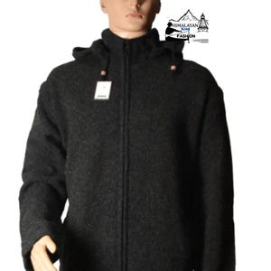 May include: A dark gray hooded jacket with a full-length zipper, displayed on a mannequin. The jacket has a textured appearance and a tag attached. The image also includes the text "Himalayan Soul Fashion".