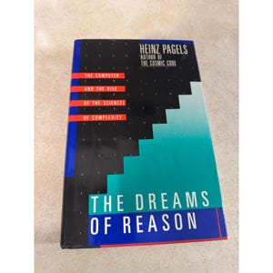 May include: A hardback book titled The Dreams of Reason: The Computer and the Rise of the Sciences of Complexity by Heinz Pagels, author of The Cosmic Code. The cover features a black, teal, and blue geometric design with white and red text.