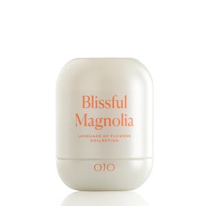 May include: A white, rounded container with the words "Blissful Magnolia" in coral lettering. Below, it reads "LANGUAGE OF FLOWERS COLLECTION" and the brand name "OJO". The container has a two-part design.