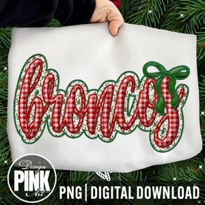 May include: A white tote bag with the word "Broncos" in a red and white plaid design, outlined in green. A green bow is on the right side. The bag has the text "Design Pink Art" and "PNG | DIGITAL DOWNLOAD" in a circle at the bottom.