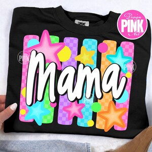 May include: Black sweatshirt with the word "Mama" in white script. The design includes colorful vertical stripes, stars, and circles in pink, blue, yellow, and orange. The sweatshirt has a crew neck and a tag that says "Comfort".