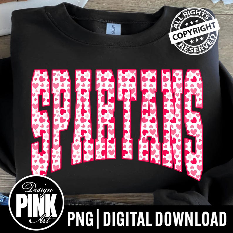 May include: Black sweatshirt with the word "SPARTANS" in large, pink letters filled with small pink hearts. The design includes a "Design Pink Art" logo and the text "PNG | DIGITAL DOWNLOAD". A copyright stamp is visible.