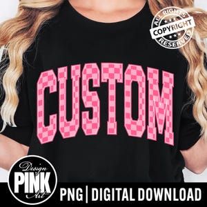 May include: Black t-shirt with the word "CUSTOM" in large, pink, checkered letters across the front. The shirt also features a "Design Pink Art" logo and the text "PNG | DIGITAL DOWNLOAD".
