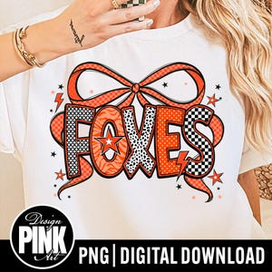 May include: White t-shirt featuring the word "FOXES" in orange, black, and white patterns, with a bow and stars design. The shirt also includes the text "PNG | DIGITAL DOWNLOAD" and the "Design PINK Art" logo.