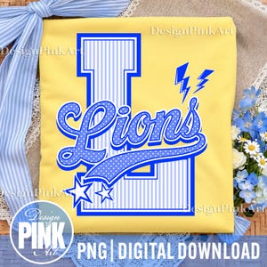 May include: A yellow t-shirt featuring a large blue letter L with vertical stripes, overlaid with the word Lions in a blue script font with white polka dots. The design includes two blue lightning bolts and two blue stars at the bottom.