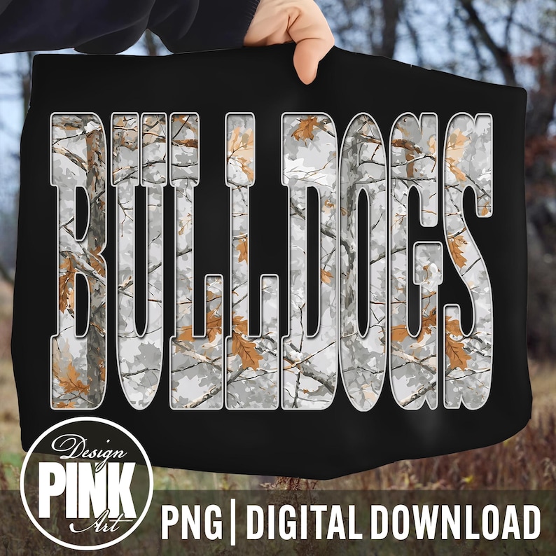 May include: Black digital design featuring the word "BULLDOGS" in large, white, block letters. The letters are filled with a camouflage pattern of grey, white, and brown. The design includes the text "Design PINK Art" and "PNG | DIGITAL DOWNLOAD".