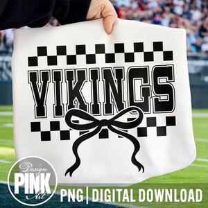 May include: White tote bag with the word "VIKINGS" in bold black letters, a black bow, and a checkered pattern. The bag also has the text "PNG DIGITAL DOWNLOAD" and the "Design Pink Art" logo.