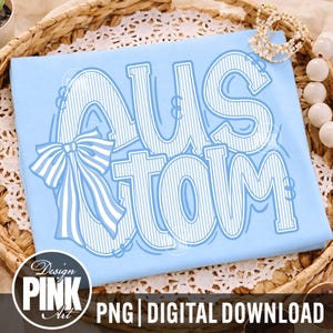 May include: Light blue t-shirt with the word "CUSTOM" in a white, outlined font with blue stripes. A white bow with blue stripes is on the left. The words "Design Pink Art" and "PNG | DIGITAL DOWNLOAD" are at the bottom.