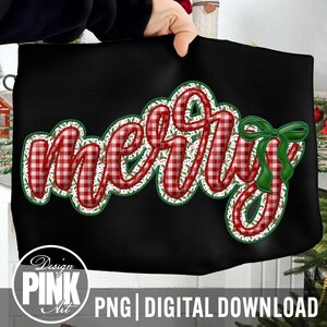May include: Black tote bag with the word "MERRY" in a red and white plaid design, outlined with a white and green floral pattern. A green bow is on the right side. The bottom of the bag has the text "PNG | DIGITAL DOWNLOAD".