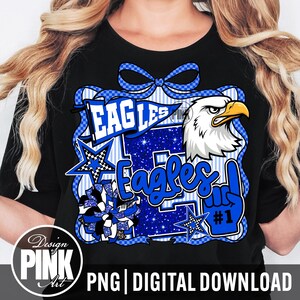 May include: Black t-shirt with a blue and white Eagles graphic. The design includes an eagle head, stars, and the word "Eagles" in a stylized font. A blue bow and the text "#1" are also featured.