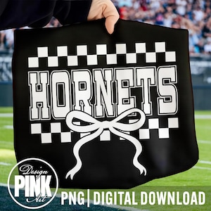 May include: Black tote bag with the word "HORNETS" in large white block letters, a white bow graphic, and a checkered pattern. The bag is held up by a hand. The words "PNG DIGITAL DOWNLOAD" are at the bottom.
